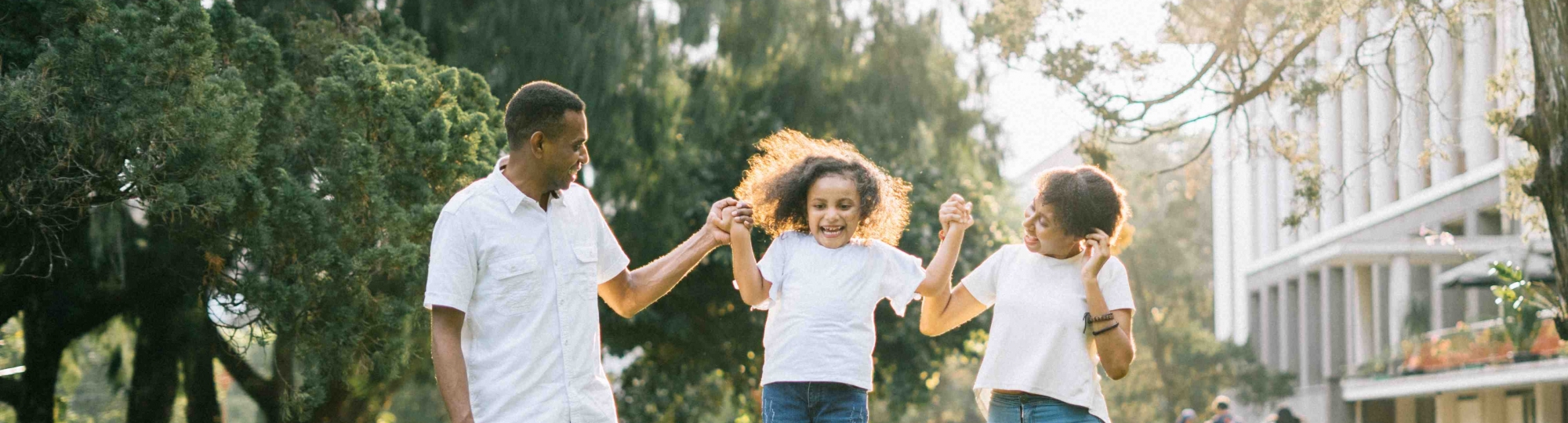 A family enjoys a walk in a park