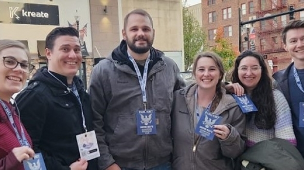 Restaurant Tour participants show off their Passports